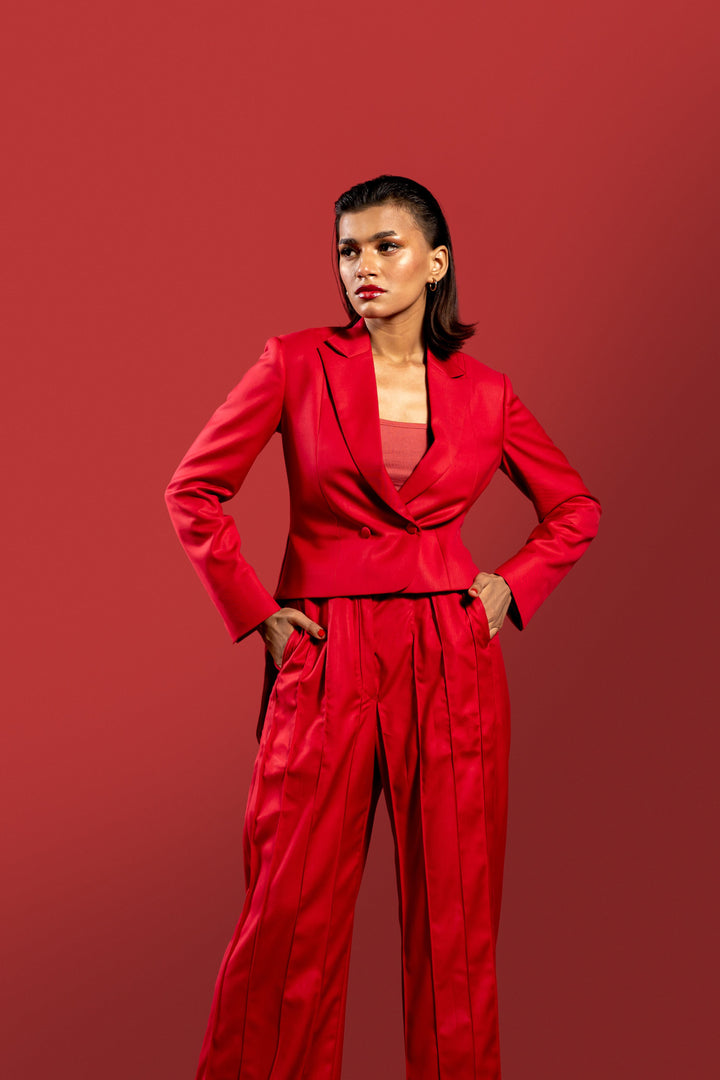 Modern Red 2-Piece Suit for Women: Pleated Pants & Long Tail Crop Blazer.