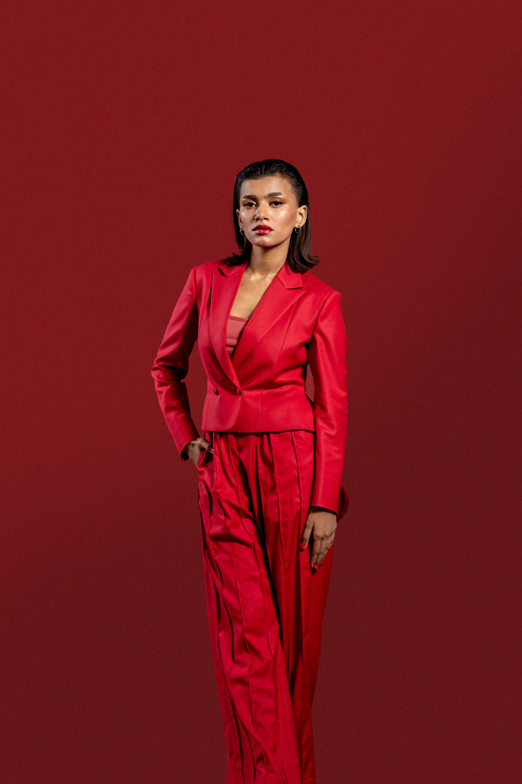 Modern Red 2-Piece Suit for Women: Pleated Pants & Long Tail Crop Blazer.